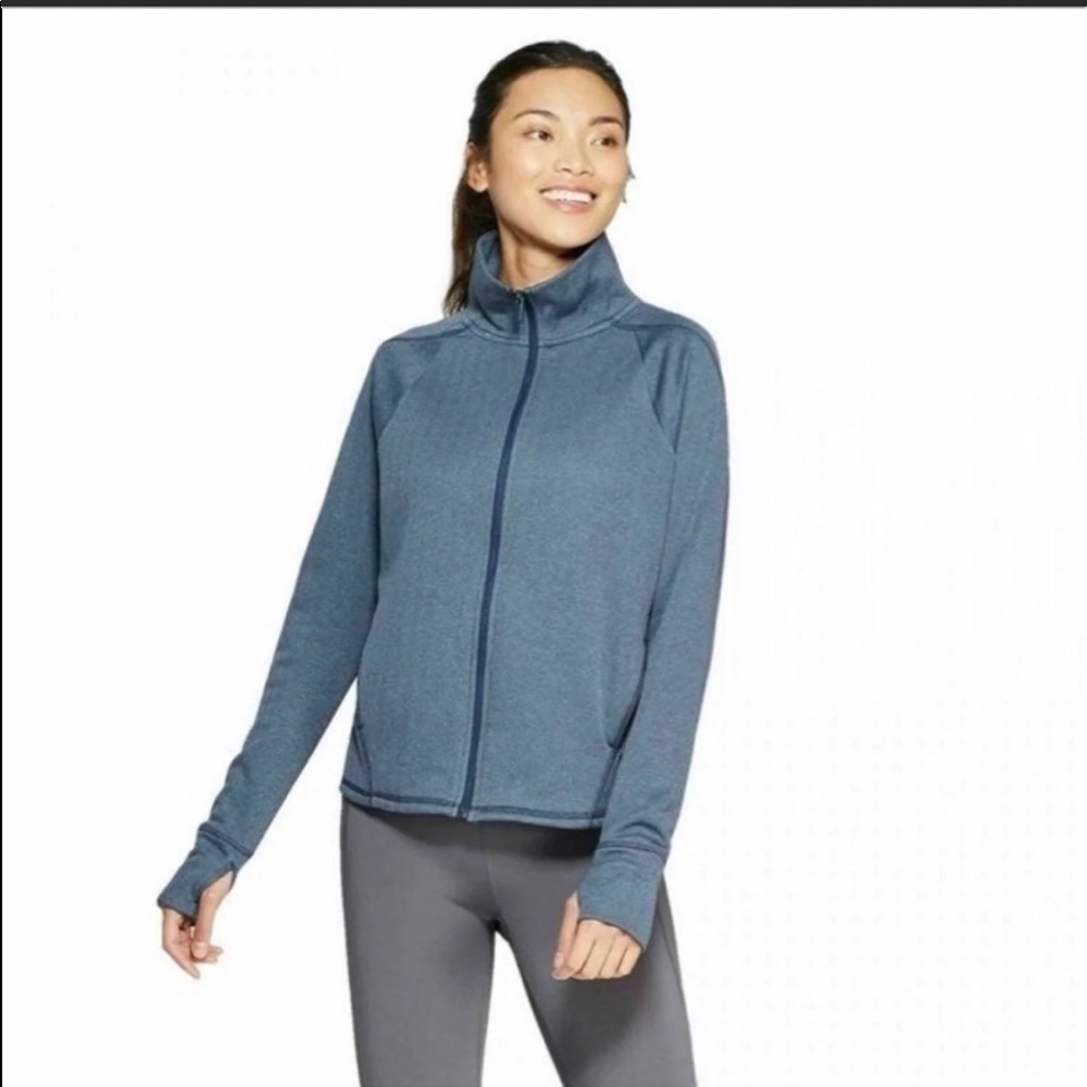 Champion teal fleece lined jacket. Pockets and thumb holes. New with tag.